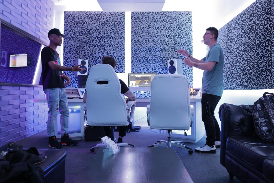 A crew working together in one of the rooms between takes